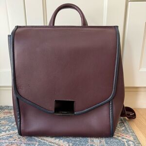 Tumi Genuine Leather dark purple luggage backpack